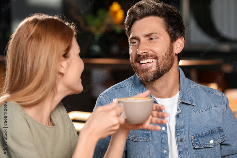 Romantic date. Happy couple spending time together in cafe Romantic date. Happy couple spending time together in cafe