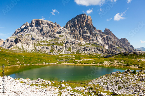 Summer sunny day at Dolomitic Alps: turquoise hue see-through water of Laghi dei Piani