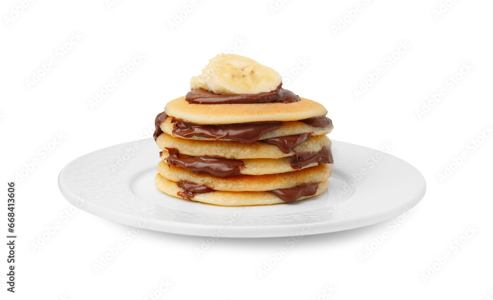 Stack of tasty pancakes with chocolate spread and banana slices isolated on white