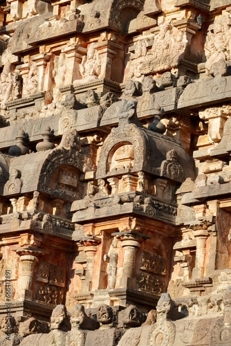 Ancient Hindu temple tower with stone carvings of God sculpture. Tall tower with idols at Airavatesvara Temple, Darasuram, Kumbakonam, Tamilnadu.