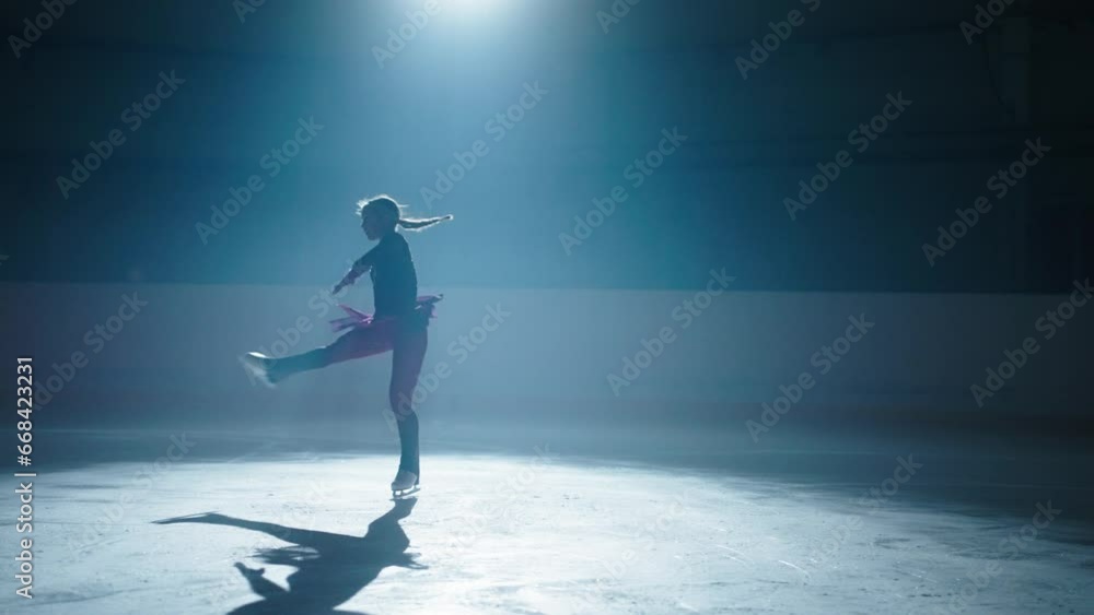 Champion Woman Of Figure Skating Training On Ice Rink In Night, Silhouette Of Graceful Lady Champion Woman Of Figure Skating Training On Ice Rink In Night, Silhouette Of Graceful Lady