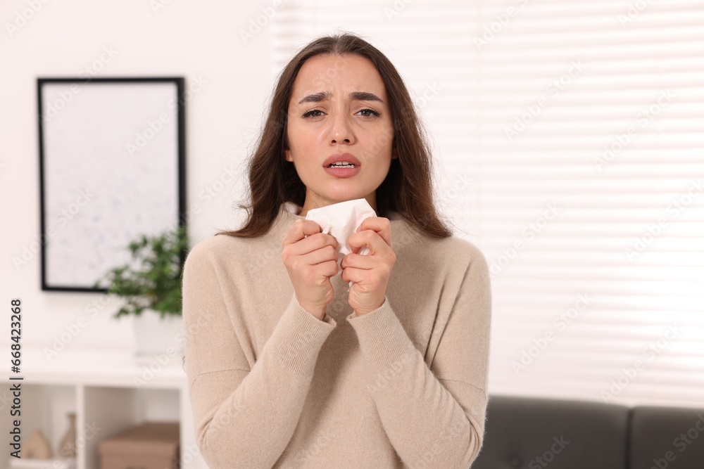 Sick woman with tissue at home. Cold symptoms Sick woman with tissue at home. Cold symptoms