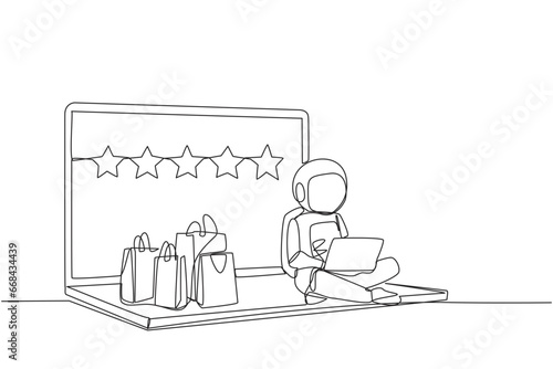 Single continuous line drawing happy astronaut sitting on giant laptop typing on laptop. Bought a lot from online shop. Give a review of 5 stars. Ecommerce. Cosmic. One line design vector illustration