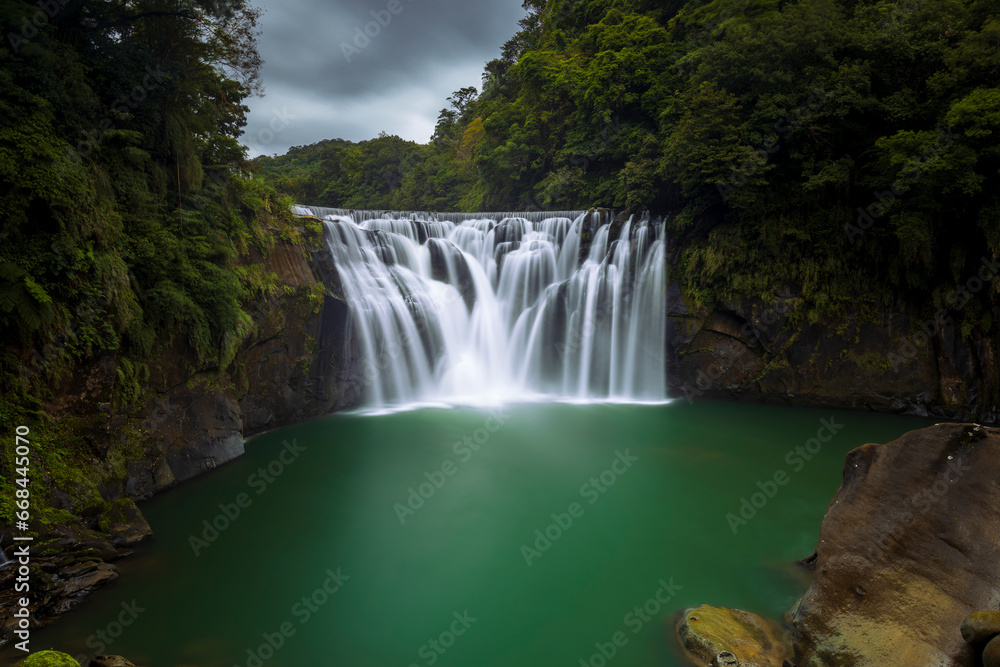 Naklejka premium waterfall in the forest