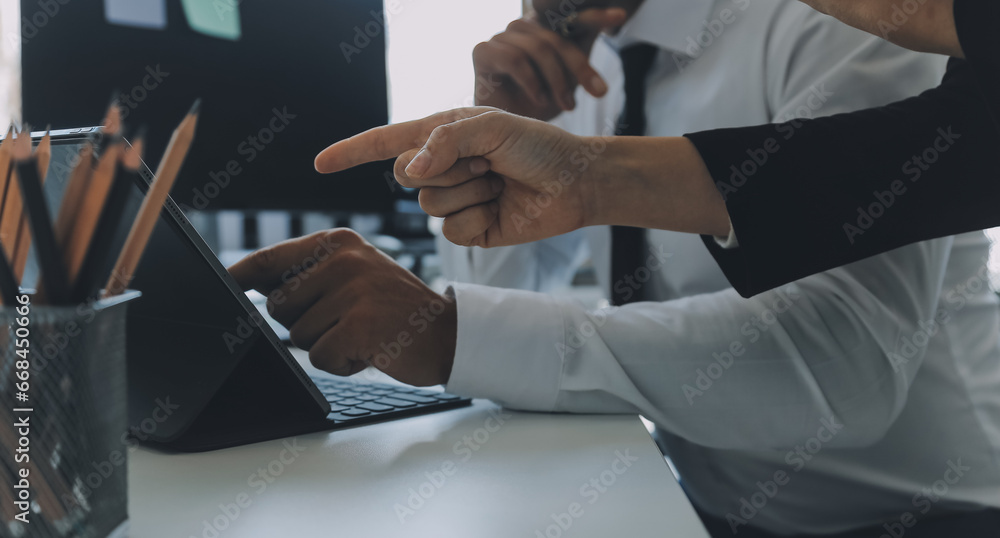 Close up of Business team analyzing income charts and graphs with modern laptop computer. Business analysis and strategy concept.