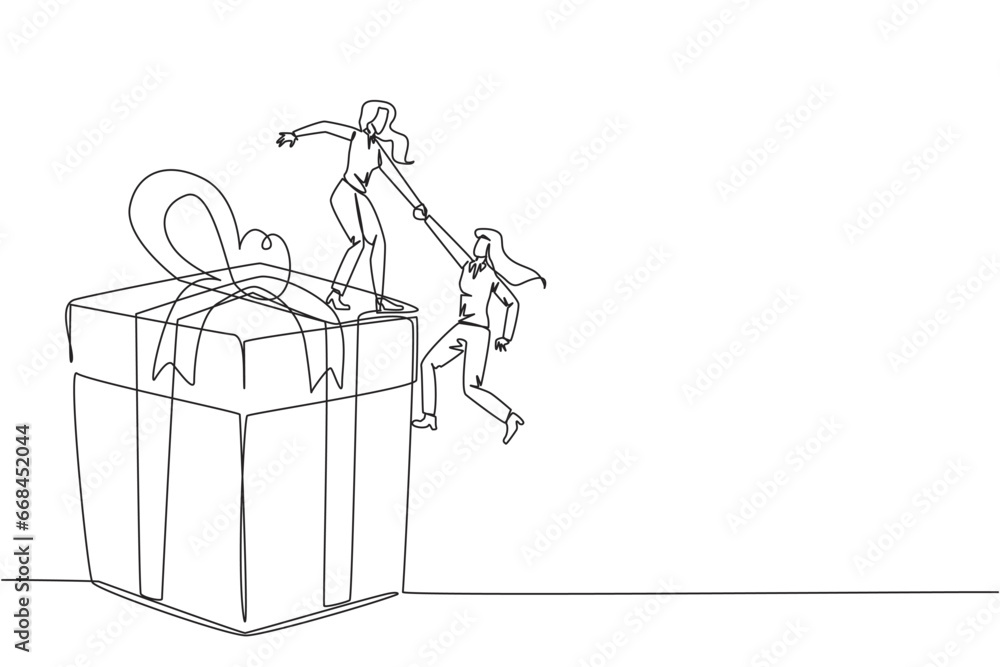 Single one line drawing businesswoman helps colleague climb big gift box. Integrated teamwork to reach the highest level for rewards. Helping each other. Continuous line design graphic illustration