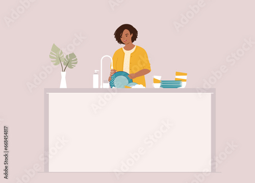 One Smiling Black Woman Standing At Kitchen Sink Washing Dishes Under Running Water. Half Length.