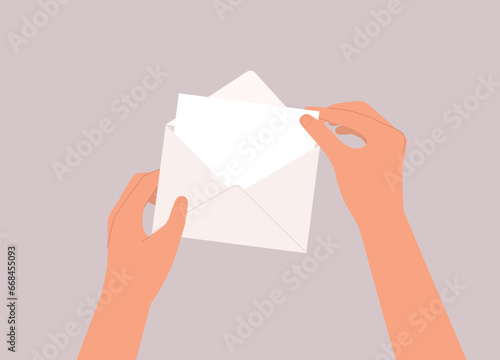 A Person’s Hand Taking A Blank Empty White Card Out From The Envelope. Close-Up.