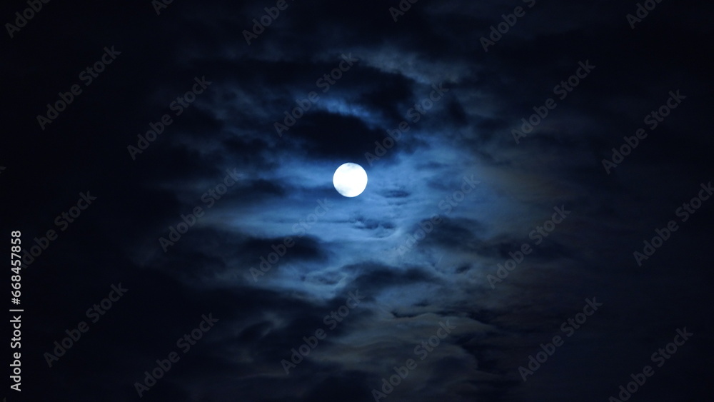 The night sky view with the round moon in the sky at night The night sky view with the round moon in the sky at night