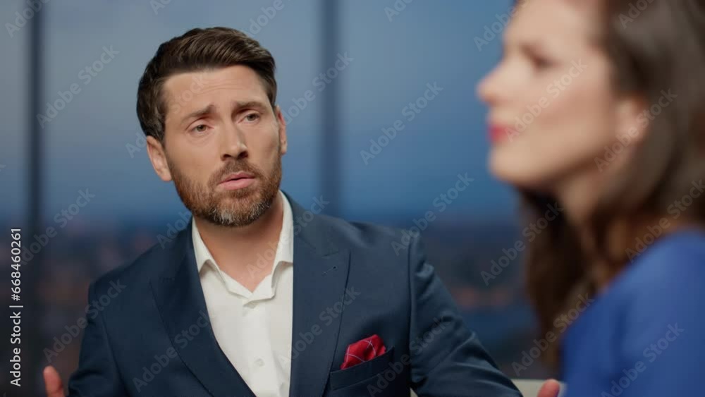Sad talk show guest discussing life problem with presenter in studio close up. Sad talk show guest discussing life problem with presenter in studio close up.