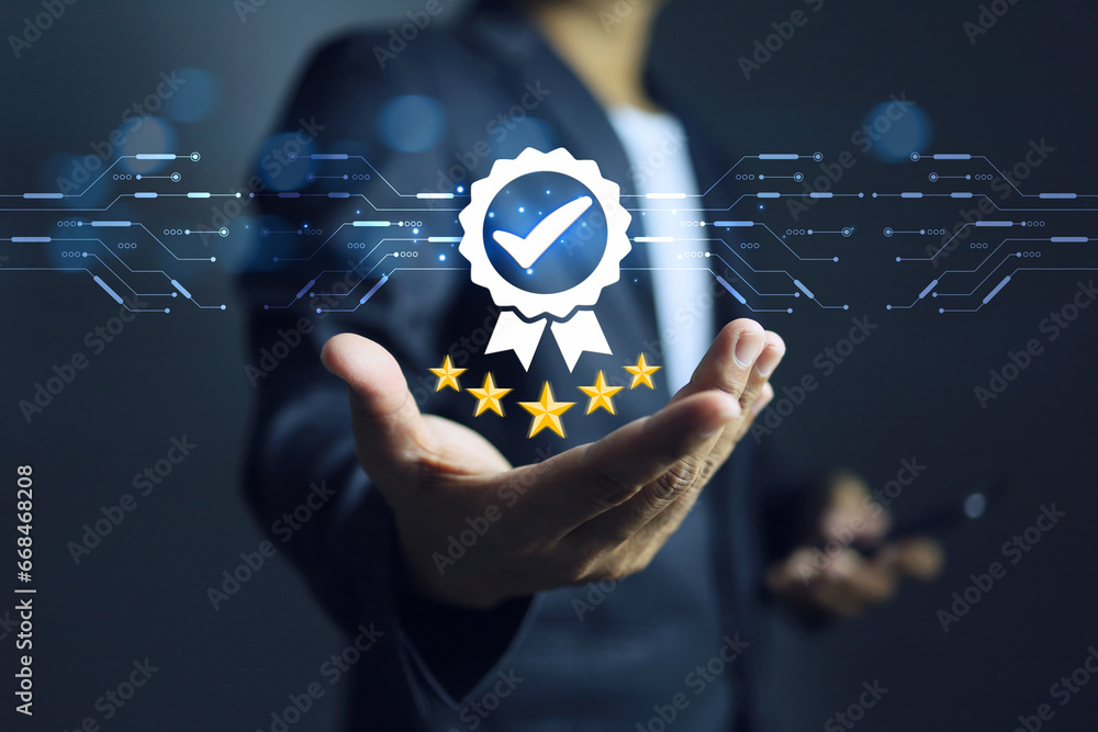 Businessman hold a 5 star quality certification mark indicating the