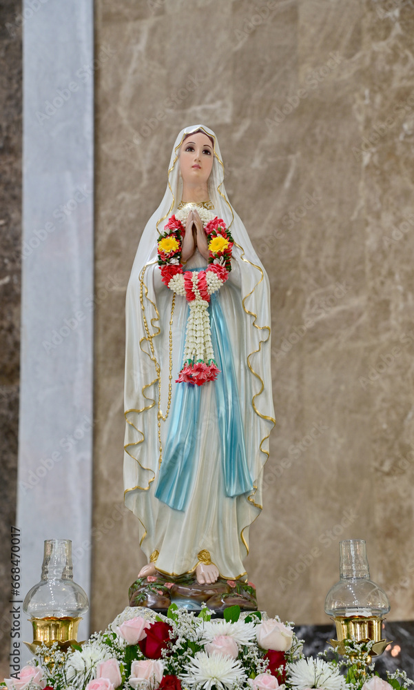 Close-up of Beautiful Statue of Our lady of grace virgin Mary located in the church, Thailand. selective focus. Close-up of Beautiful Statue of Our lady of grace virgin Mary located in the church, Thailand. selective focus.
