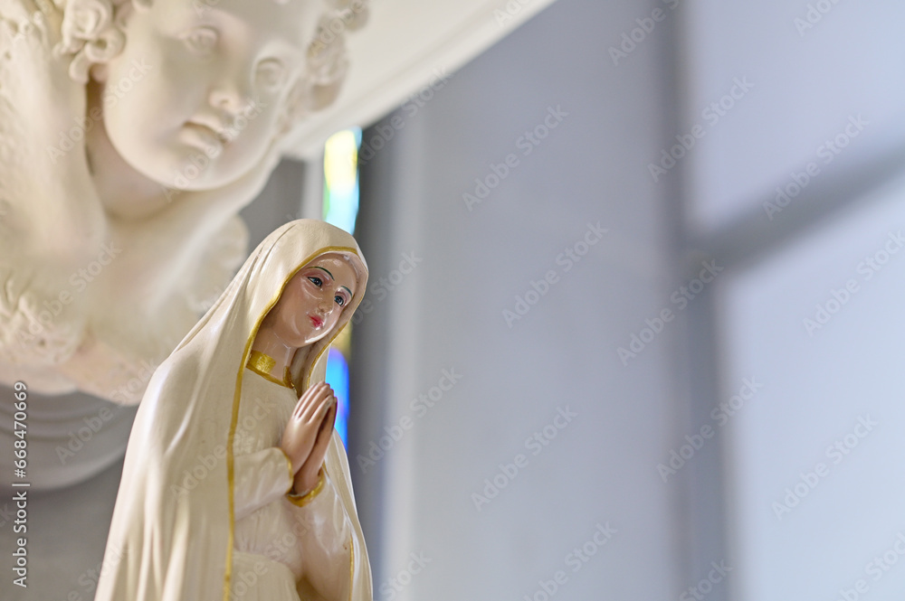 Close-up of Beautiful Statue of Our lady of grace virgin Mary located in the church, Thailand. selective focus.
