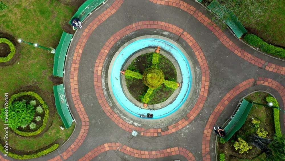Banos, Ecuador: 10-11-2022: close up to high angle top view of a beautiful decorated park Banos, Ecuador: 10-11-2022: close up to high angle top view of a beautiful decorated park