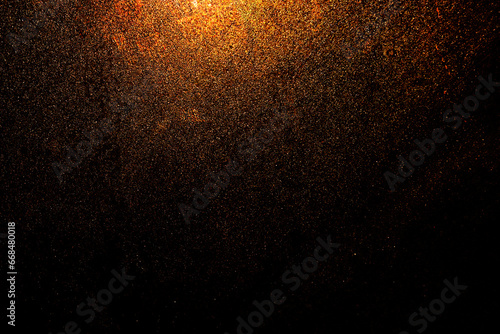 Black dark orange red golden brown shiny glitter abstract background with space. Twinkling glow stars effect. Like outer space, night sky, universe. Rusty, rough surface, grain.