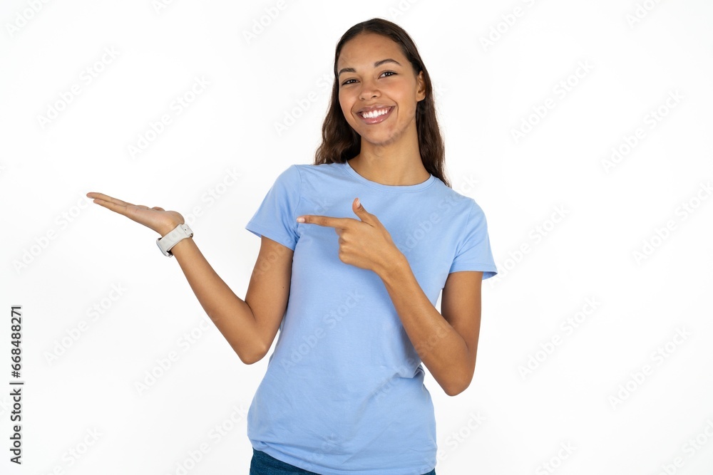 Positive young beautiful woman promoter point index finger copyspace hold hand demonstrate offer ads promo Positive young beautiful woman promoter point index finger copyspace hold hand demonstrate offer ads promo