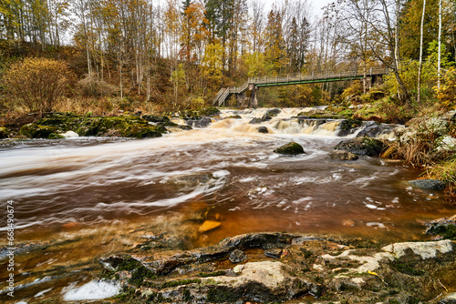 waterfall in river in late autumn
