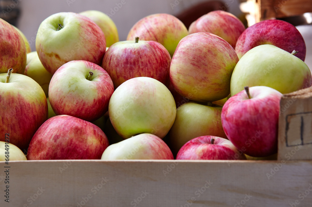 Wooden crate box full of fresh apples. Overhead view of fresh organic apples harvesting concept Wooden crate box full of fresh apples. Overhead view of fresh organic apples harvesting concept