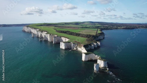 Excellent Smooth Drone Orbit around UNESCO Heritage Site, Old Harry Rocks and English Green Coastal Fields. photo