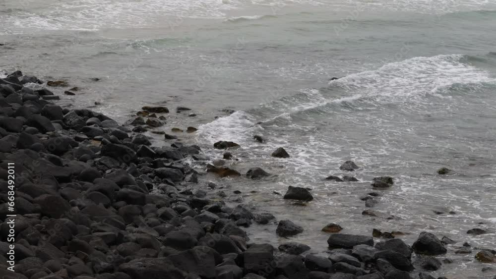 Close up of a powerful ocean wave hitting the sandy beach in Australia Close up of a powerful ocean wave hitting the sandy beach in Australia