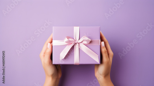 Gift box with bow on isolated background © Taisiia