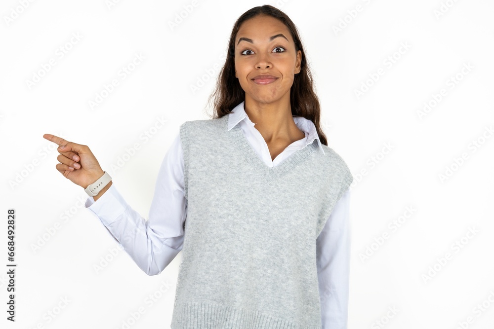 Positive Beautiful businesswoman wearing formal clothes with satisfied expression indicates at upper right corner shows good offer suggests to click on link Positive Beautiful businesswoman wearing formal clothes with satisfied expression indicates at upper right corner shows good offer suggests to click on link