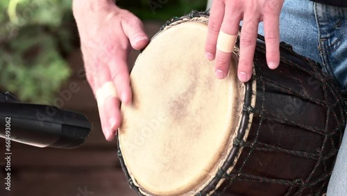 A Man Playing the Hand Drum - Slow Motion photo