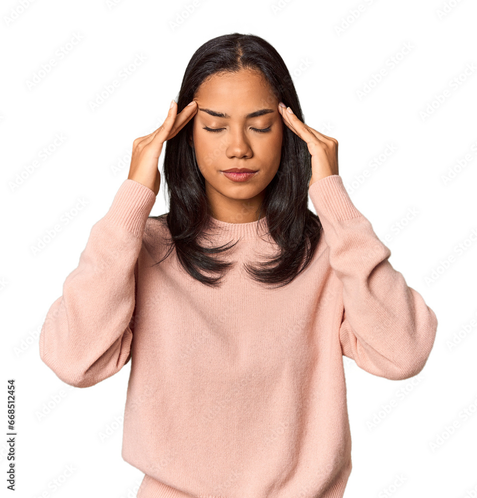 Young Filipina with long black hair in studio touching temples and having headache. Young Filipina with long black hair in studio touching temples and having headache.