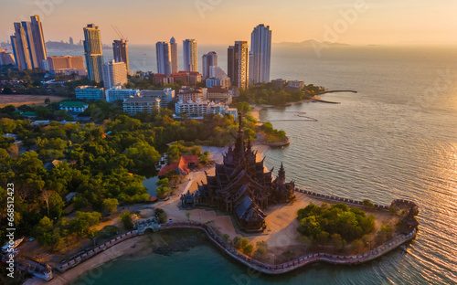Sanctuary of Truth, Pattaya, Thailand, wooden temple by the ocean at sunset on the beach of Pattaya