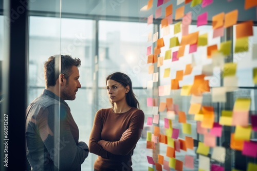 Business people, team and thinking in planning for schedule brainstorming or meeting at office. Man and woman in teamwork decision for project plan, tasks or sticky note ideas in startup at workplace.