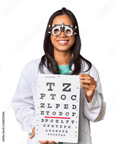 Young Filipina ophthalmologist holding optometry test chart photo