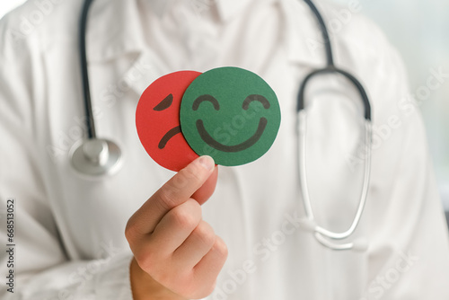 Konstfotografi Close up unknown woman doctor holding happy and angry face paper