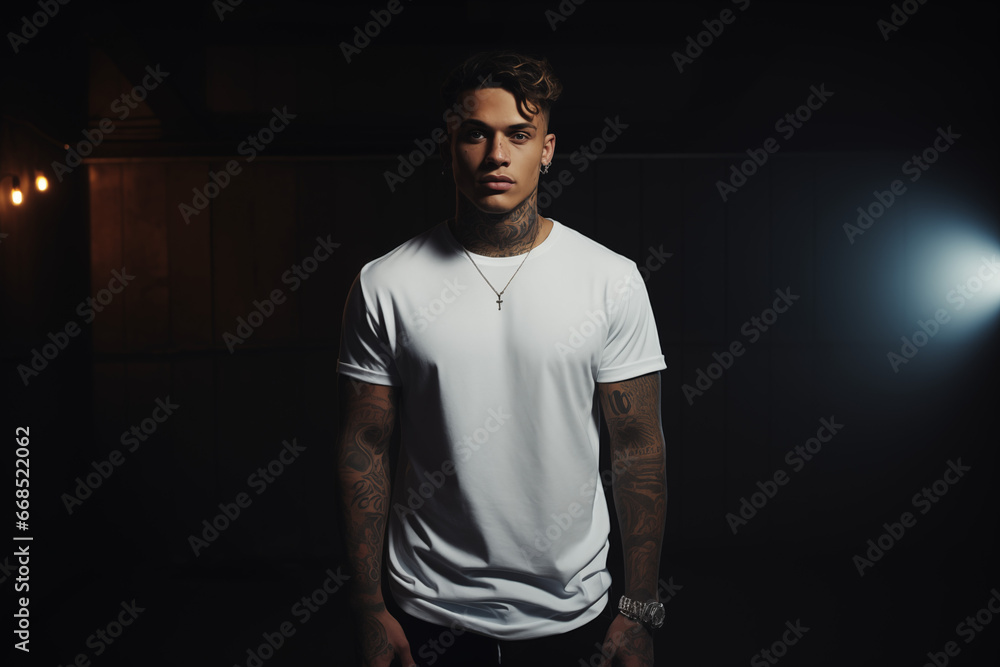 Tribal Looking Model with Tattoos in Plain White T-Shirt against Wild Background with Studio Lighting and Bokeh Tribal Looking Model with Tattoos in Plain White T-Shirt against Wild Background with Studio Lighting and Bokeh
