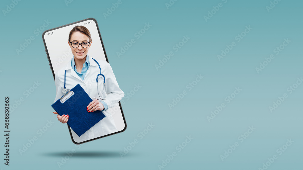 Confident young female doctor smiling and posing with clipboard in a smartphone videocall and smiling, online service concept Confident young female doctor smiling and posing with clipboard in a smartphone videocall and smiling, online service concept