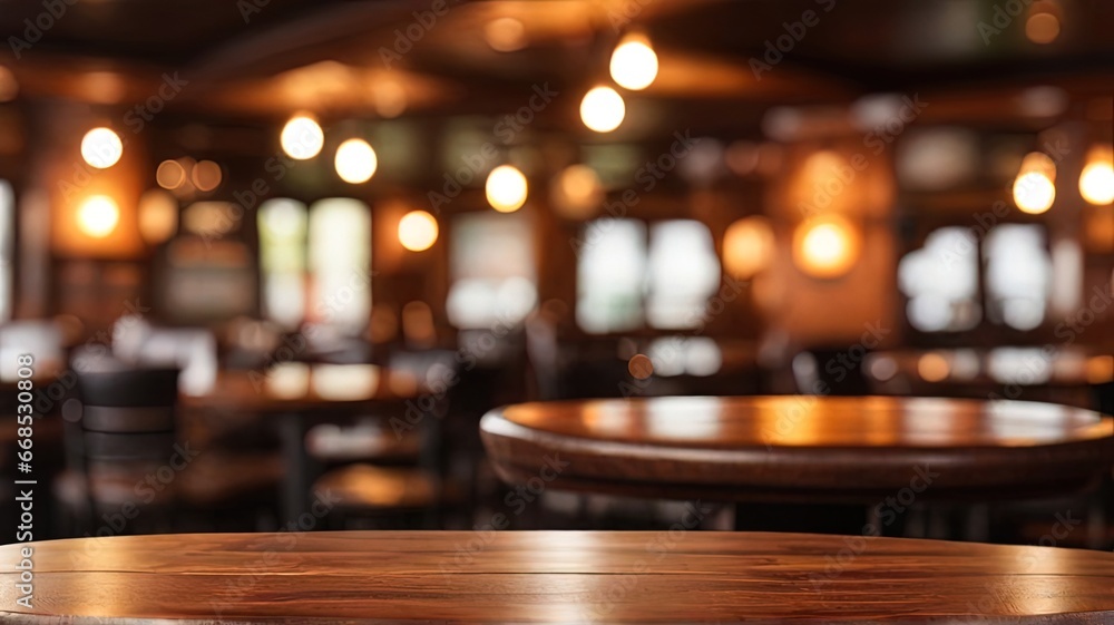 Empty wooden table and blurred background of bar, pub or restaurant. For product display.