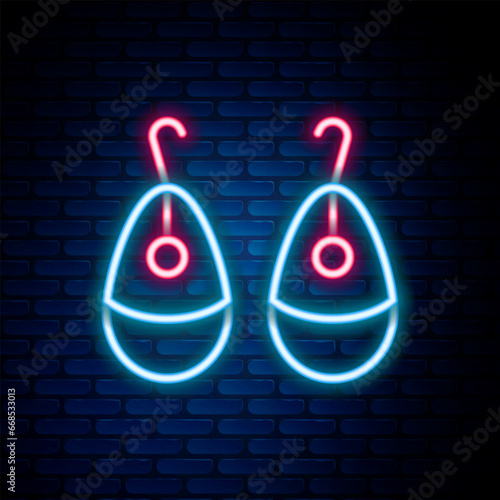 Glowing neon line Earrings icon isolated on brick wall background. Jewelry accessories. Colorful outline concept. Vector