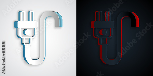 Paper cut Electric plug icon isolated on grey and black background. Concept of connection and disconnection of the electricity. Paper art style. Vector