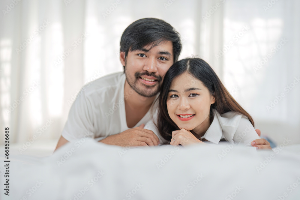 Love, happiness and a couple in bed on a beautiful morning at home. Wake up together brightly Woman and man relax in bedroom, romance, happiness Love, happiness and a couple in bed on a beautiful morning at home. Wake up together brightly Woman and man relax in bedroom, romance, happiness