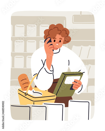 Woman calling, talking on mobile phone while shopping in grocery store. Femal...