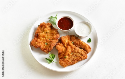 Breaded wiener schnitzel with sauce