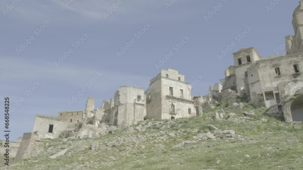 CRACO, ITALY - MAY 2, 2023: the abandoned town, far view from the below valley, looking at the ruins with a camera panning movement from left to right.
CRACO, ITALY - MAY 2, 2023: the abandoned town, far view from the below valley, looking at the ruins with a camera panning movement from left to right.