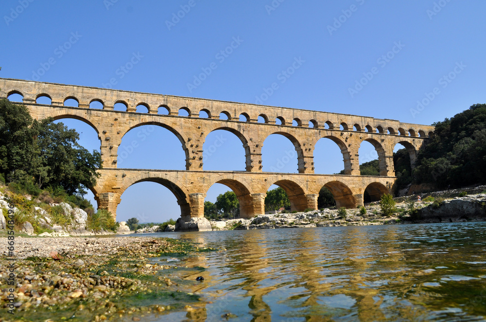 The old Roman Viaduct Pont du Gard in the south of France in the Provence region. Historical monument building.