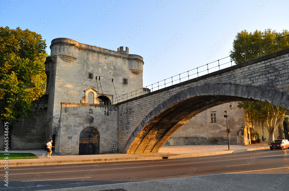Avignon, France - Old stone bridge in the city center on the river Rhone embankment.
