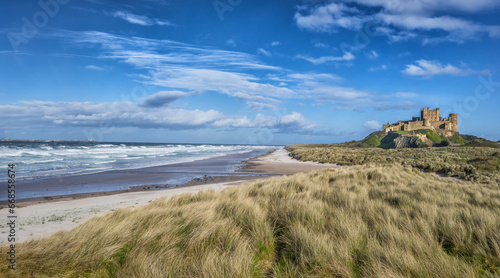 Bamburgh Castle and beach on the coast of Northumberland in England