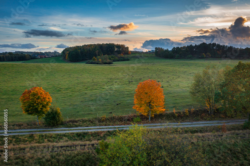 Beautiful landscape with autumn trees at sunset. Poland photo