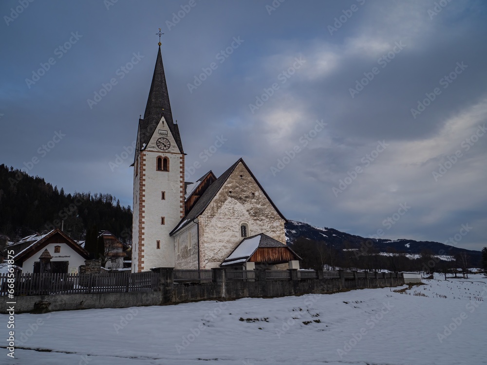 Winter landscape with alpine mountain village and catholic church, Wallfahrtskirche Maria Schnee Matzelsdorf