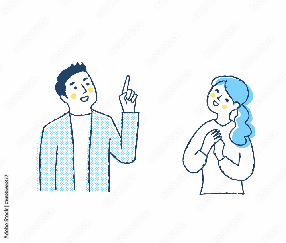上の方を見ながら喜ぶ若いカップル 上の方を見ながら喜ぶ若いカップル
