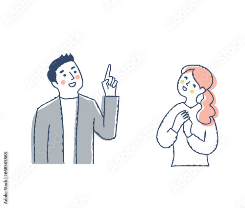 上の方を見ながら喜ぶ若いカップル