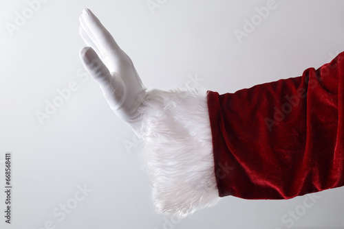 Santa claus hand making gesture of catching something isolated white
