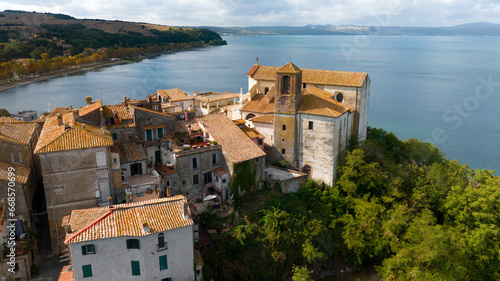 Aerial view of the collegiate church of Santa Maria Assunta in the historic center of Anguillara,in the metropolitan city of Rome, Italy. It's a Catholic church located on the shores of Lake Bracciano photo